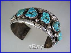 BIG HEAVY OLD NAVAJO STERLING SILVER & 9 TURQUOISE ROW BRACELET signed