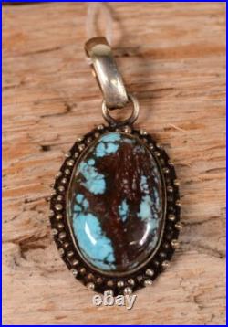 Navajo Blue Turquoise Cabochon with Dark Matrix in Sterling Silver Pendant Navajo Blue Turquoise Cabochon with Dark Matrix in Sterling Silver Pendant