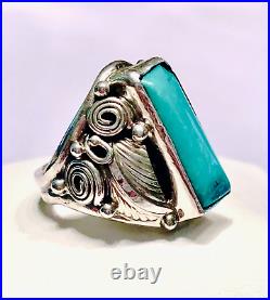 Signed Navajo Ring with Tooled Sterling Silver Leaves and Turquoise. Size 6.25